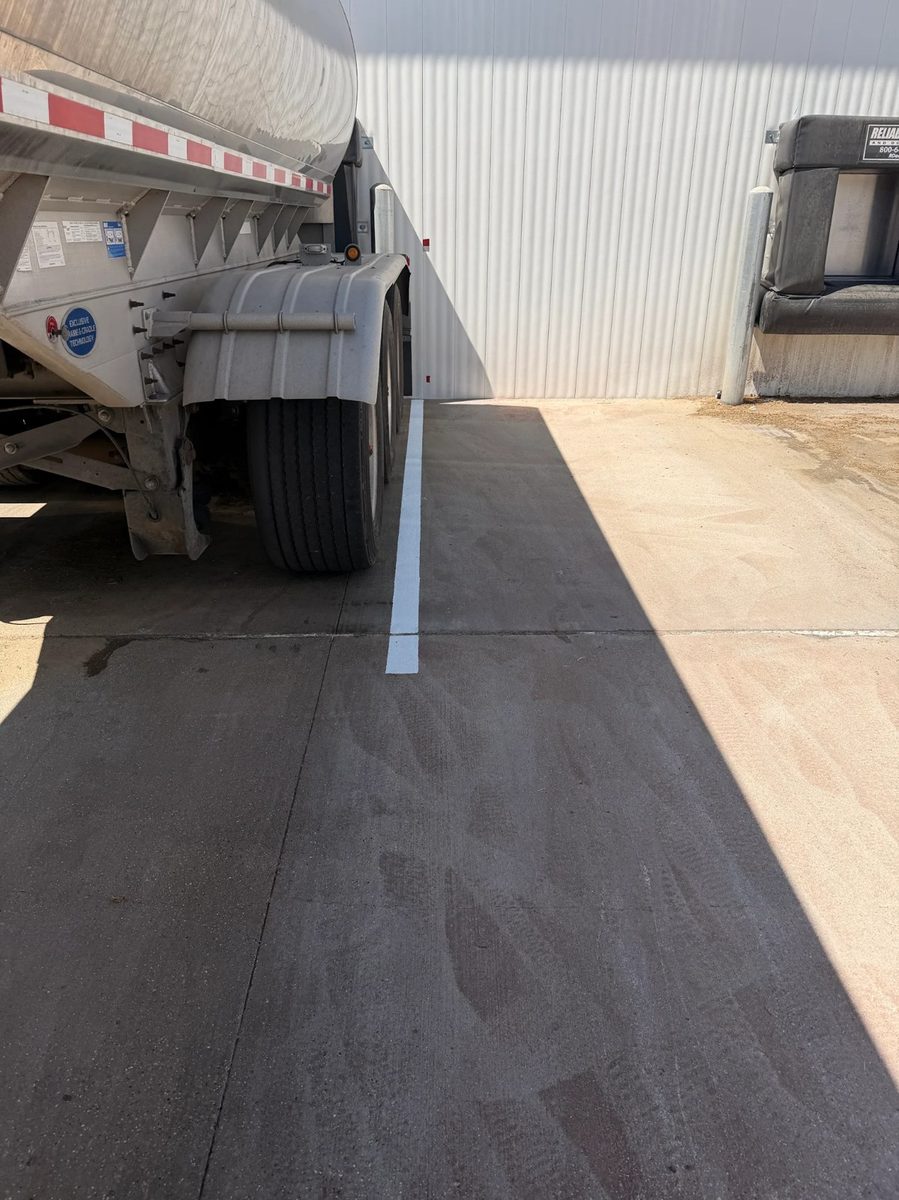 Line striping in Madison WI showing fresh painted pavement markings for a parking or loading area